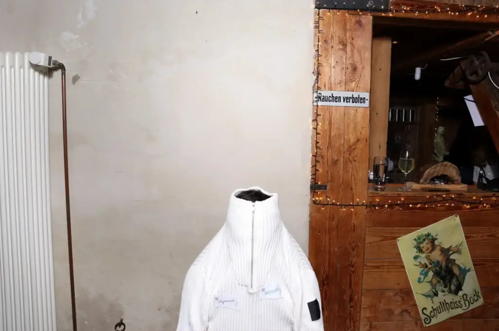 Personal studio moment featuring a white sweater in a rustic interior, reflecting the human side behind ExpoXR.